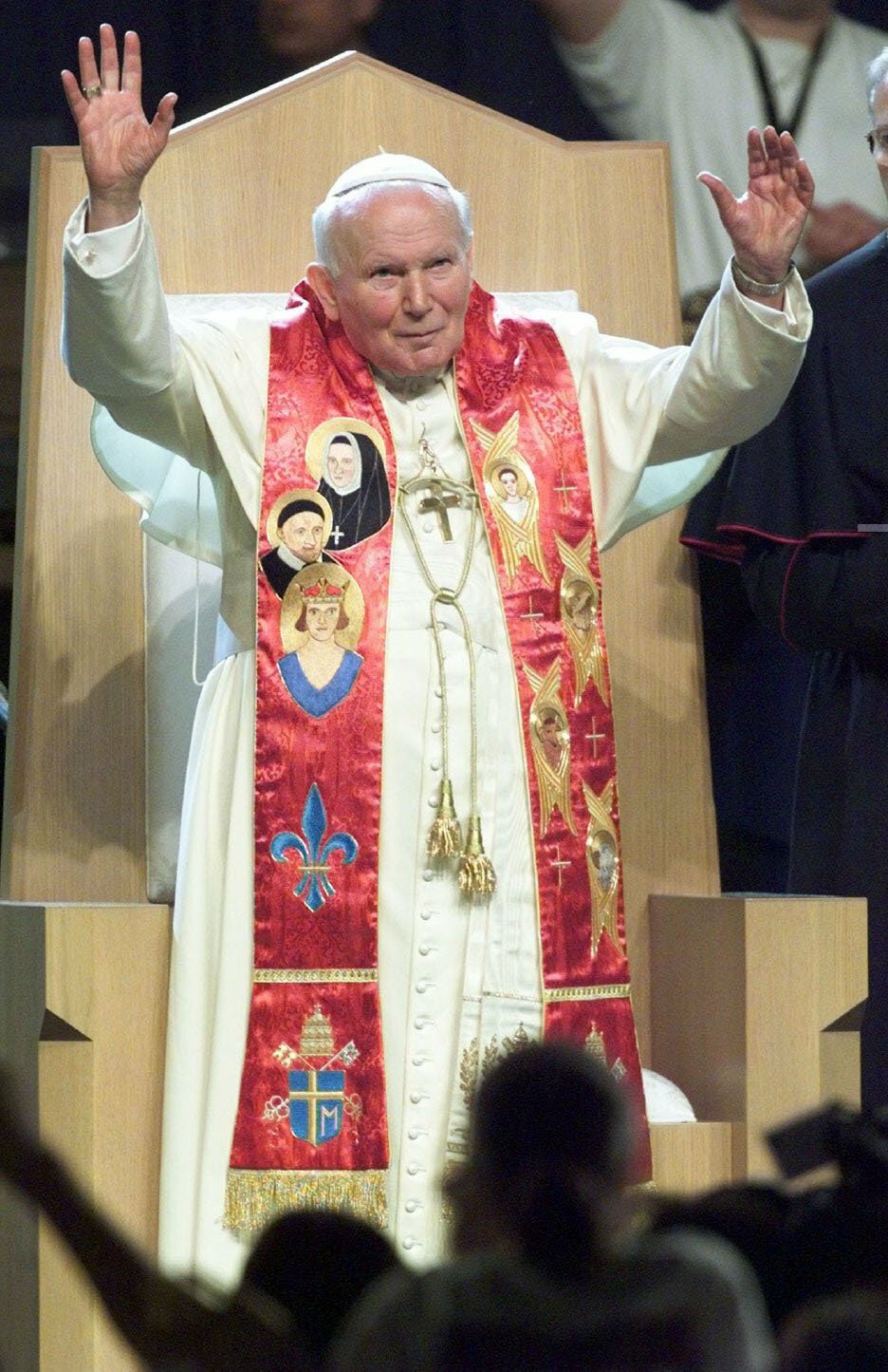 Pope John Paul II raises his arms in greeting on arrival at the Light of the World youth rally Jan. 26, 1999 at the Kiel Center in St. Louis.